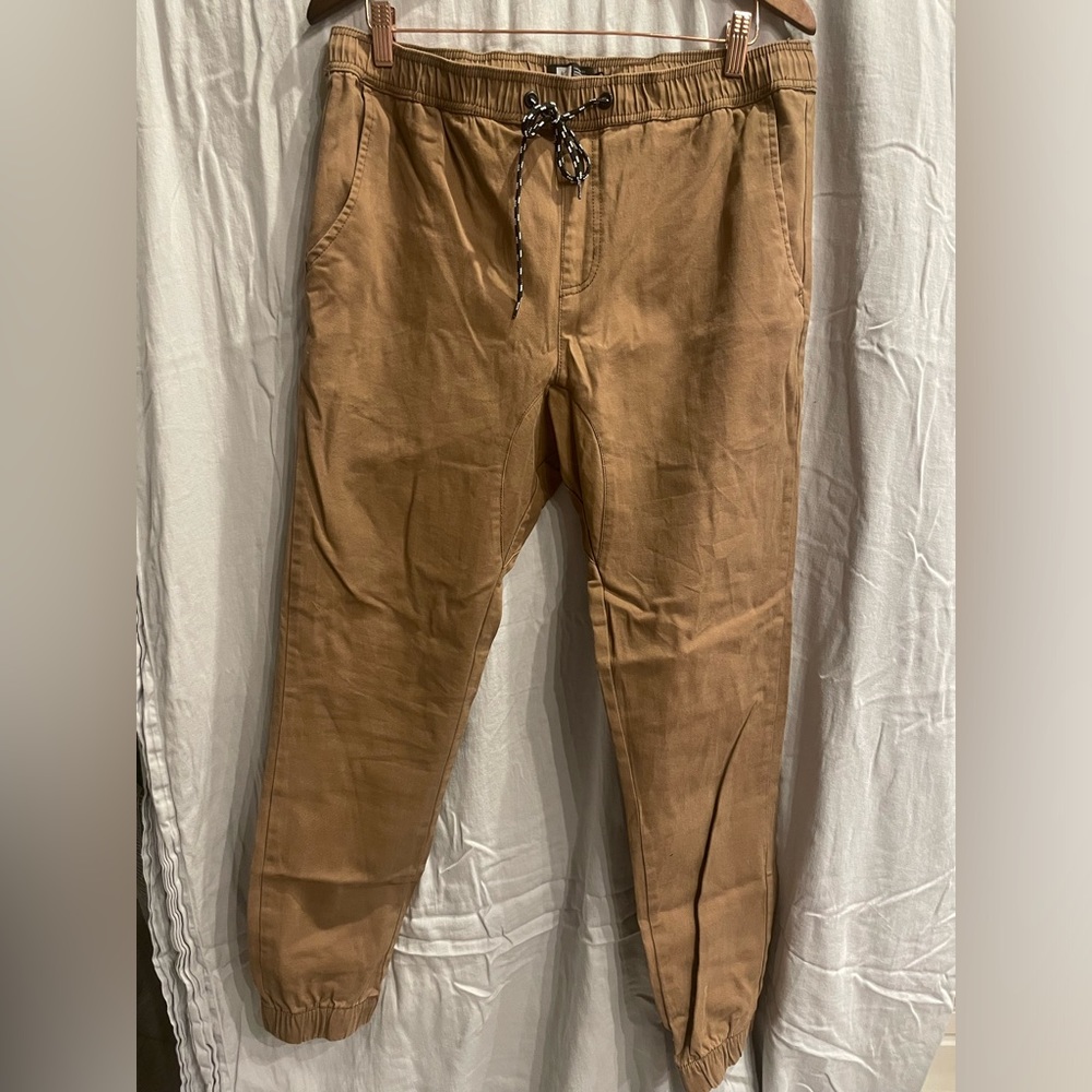 Men’s Lira tan joggers, new with out tags, size 36